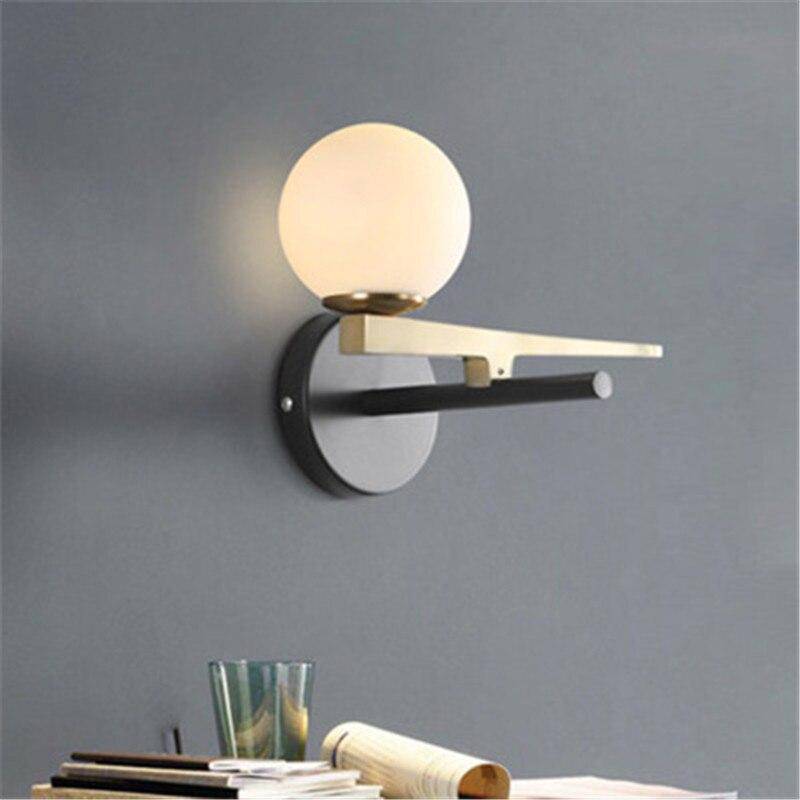 Applique murale doré avec boule en verre
