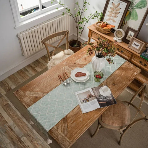 Chemin de table bohème beige motifs géométriques pompons