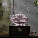 Théière verre borosilicate poignée articulée fonction papillon