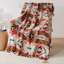 Plaid tricot motif geometrique boheme avec pompons doux