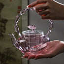 Théière verre borosilicate poignée articulée fonction papillon