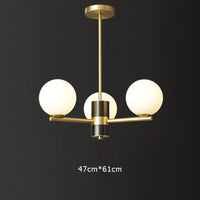 suspension nordique luxe en cuivre doré avec boules de verre blanches