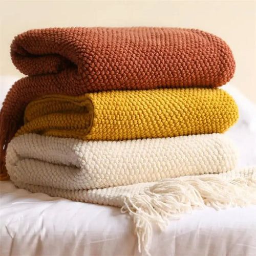 Plaid tricoté nordique à carreaux avec pompons doux