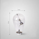 Lampe à poser design à LED chromé dans ampoule en verre