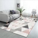Tapis moderne aux formes géométriques roses et blanches
