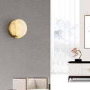 Applique murale design LED arrondi en métal dorée et marbre