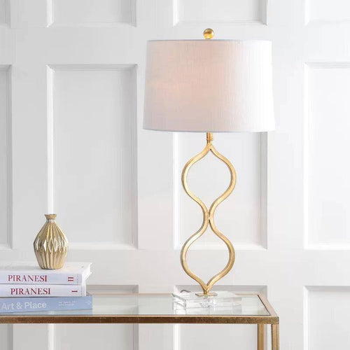 Lampe à poser design LED avec tige dorée courbée et abat-jour cylindrique