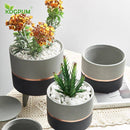 Cache-pot sur pied bas design effet ciment Ultra